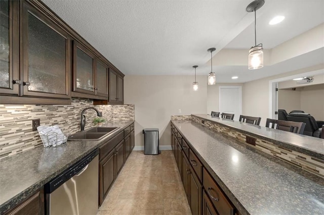 13428 W 172nd St, Overland Park, KS 66221 - kitchen featuring stainless steel dishwasher, dark countertops, dark brown cabinetry, tasteful backsplash, and hanging light fixtures