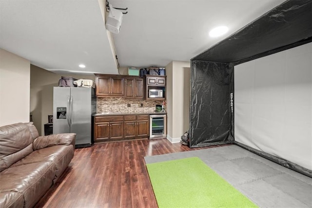 13428 W 172nd St, Overland Park, KS 66221 - kitchen featuring stainless steel fridge, wine cooler, open floor plan, recessed lighting, and backsplash