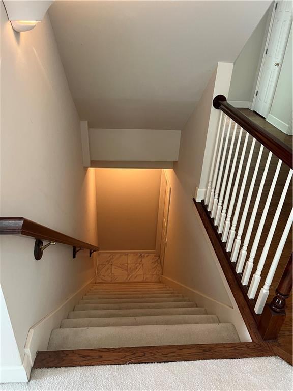 13108 Windsor Cir, Leawood, KS 66209 - stairs featuring baseboards