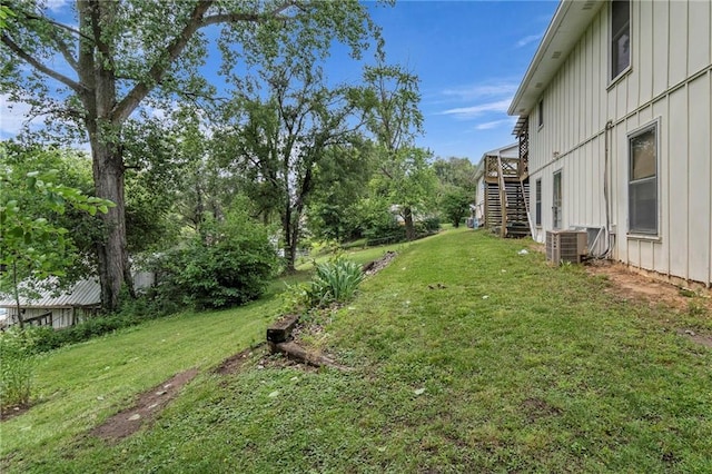 310 E Clay St, Carrollton, MO 64633 - view of grassy yard with stairs and a deck