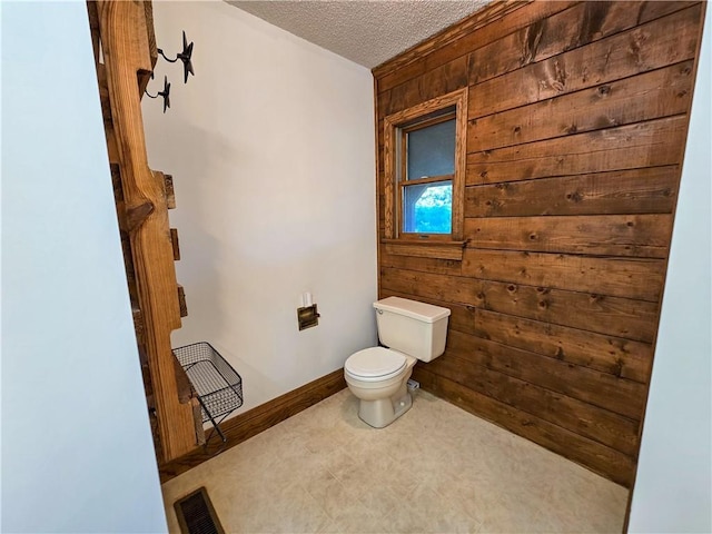 2359 Gp Rd, Ks, KS 66850 - bathroom with wood walls and a textured ceiling