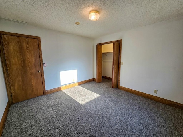 2359 Gp Rd, Ks, KS 66850 - unfurnished bedroom featuring carpet floors, a closet, and a textured ceiling