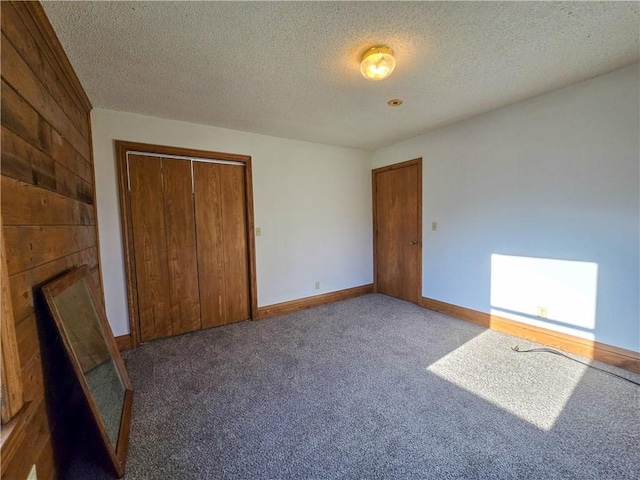 2359 Gp Rd, Ks, KS 66850 - unfurnished bedroom with carpet flooring, a closet, and a textured ceiling