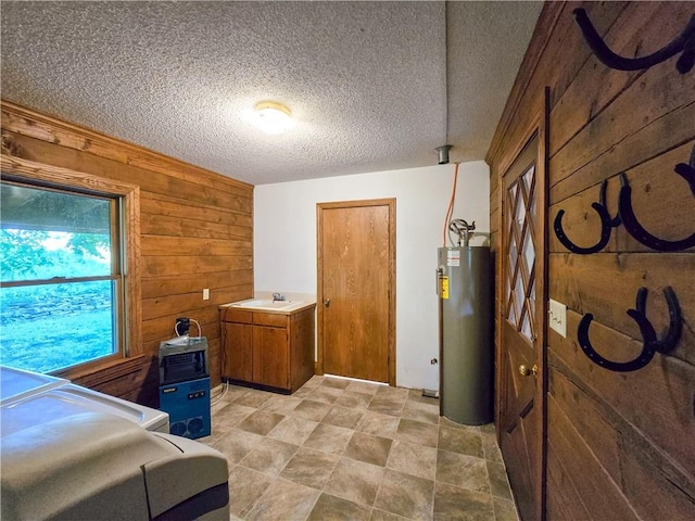 2359 Gp Rd, Ks, KS 66850 - bedroom with wood walls, water heater, and a textured ceiling