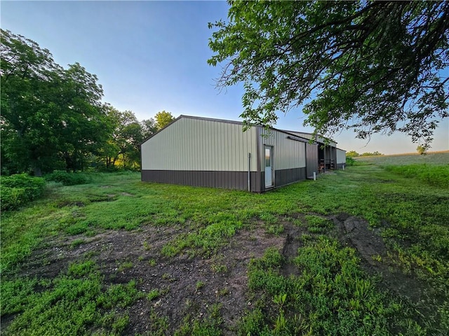 2359 Gp Rd, Ks, KS 66850 - view of side of property with a pole building, an outbuilding, and a lawn