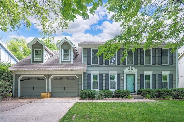 9705 N Virginia Ave, Kansas City, MO 64155 - colonial home with an attached garage, concrete driveway, and a front yard