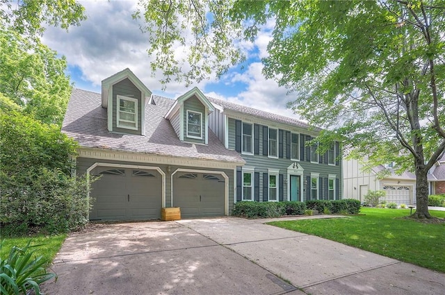 9705 N Virginia Ave, Kansas City, MO 64155 - colonial inspired home featuring a front lawn, driveway, and a garage