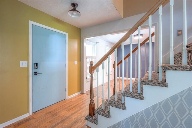 9705 N Virginia Ave, Kansas City, MO 64155 - entryway with wood finished floors and stairway