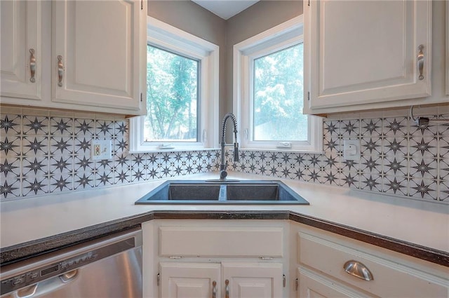 9705 N Virginia Ave, Kansas City, MO 64155 - kitchen with dishwasher, white cabinetry, tasteful backsplash, and light countertops