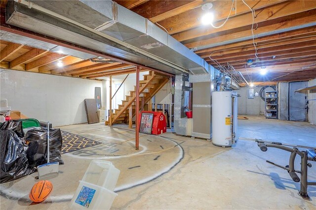 9705 N Virginia Ave, Kansas City, MO 64155 - unfinished below grade area featuring gas water heater, stairway, heating unit, and electric panel