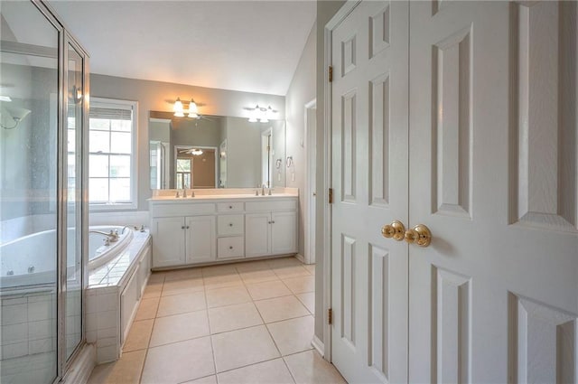 9705 N Virginia Ave, Kansas City, MO 64155 - bathroom with double vanity, a jetted tub, a stall shower, tile patterned flooring, and a ceiling fan