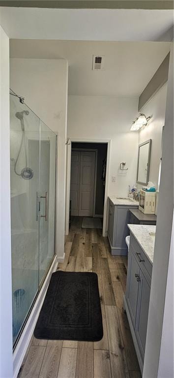 3632 SE 228th St, Lathrop, MO 64465 - bathroom with vanity, wood finished floors, and a stall shower