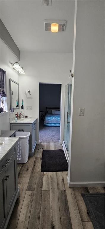 3632 SE 228th St, Lathrop, MO 64465 - ensuite bathroom featuring wood finished floors, vanity, and an enclosed shower