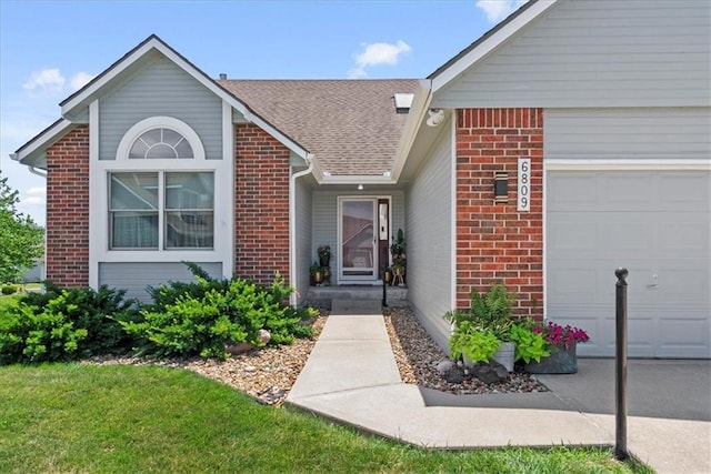 6809 W 156th St, Overland Park, KS 66223 - property entrance with brick siding, a garage, and roof with shingles