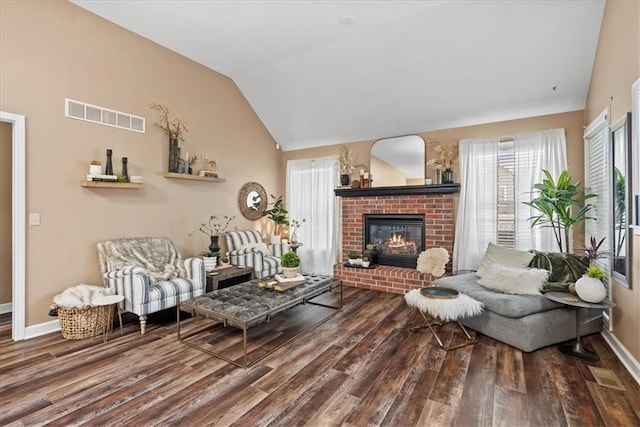 6809 W 156th St, Overland Park, KS 66223 - living area featuring wood finished floors, plenty of natural light, a fireplace, and vaulted ceiling