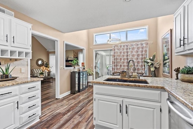 6809 W 156th St, Overland Park, KS 66223 - kitchen with dishwasher, tasteful backsplash, dark wood-style flooring, white cabinets, and light stone countertops