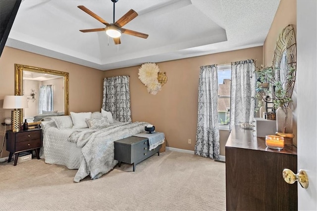 6809 W 156th St, Overland Park, KS 66223 - carpeted bedroom featuring a raised ceiling, multiple windows, and a ceiling fan