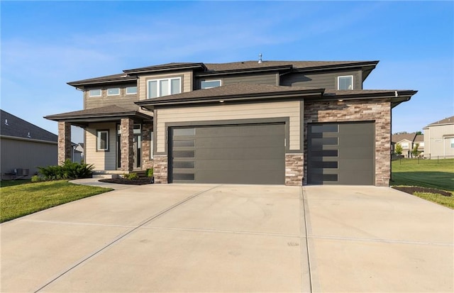 3113 SW Arboridge Dr, Lees Summit, MO 64081 - prairie-style house featuring stone siding, driveway, an attached garage, and a front yard
