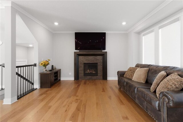 3113 SW Arboridge Dr, Lees Summit, MO 64081 - living room with light wood finished floors, recessed lighting, ornamental molding, and a fireplace