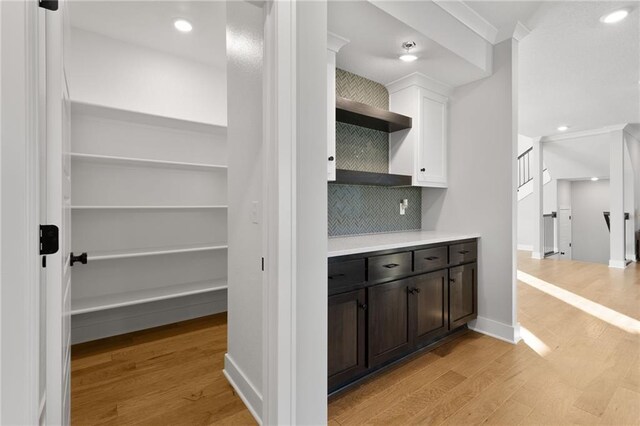 3113 SW Arboridge Dr, Lees Summit, MO 64081 - bar area featuring light wood-style floors, tasteful backsplash, and recessed lighting