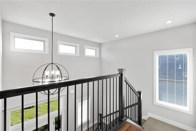 3113 SW Arboridge Dr, Lees Summit, MO 64081 - staircase with a chandelier, wood finished floors, and recessed lighting