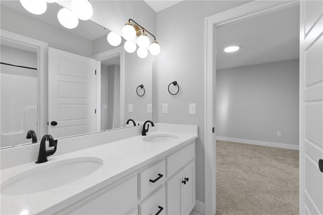 3113 SW Arboridge Dr, Lees Summit, MO 64081 - bathroom featuring double vanity and baseboards