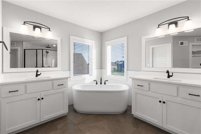 3113 SW Arboridge Dr, Lees Summit, MO 64081 - full bath featuring a shower stall, two vanities, wainscoting, and a freestanding tub