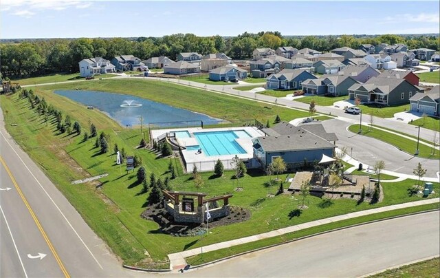 3113 SW Arboridge Dr, Lees Summit, MO 64081 - aerial view of residential area featuring a pool area and a nearby body of water