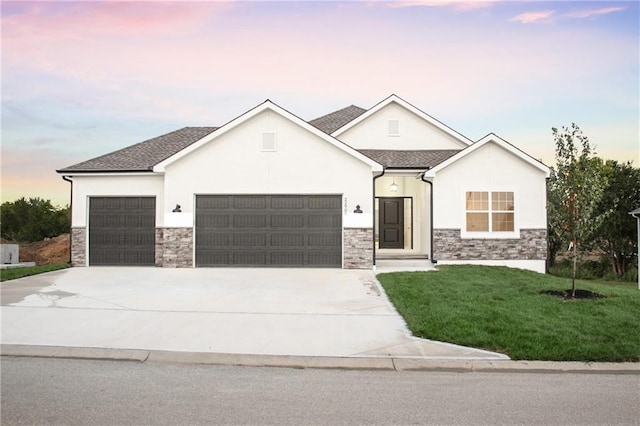 22902 S Ridgeview Dr, Peculiar, MO 64078 - modern inspired farmhouse with an attached garage, stone siding, concrete driveway, a yard, and stucco siding