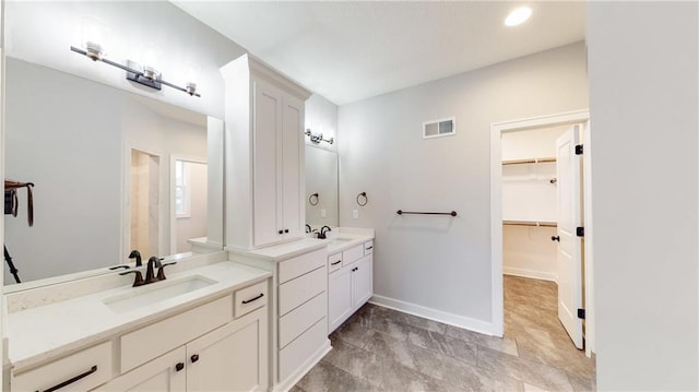 22902 S Ridgeview Dr, Peculiar, MO 64078 - full bathroom with two vanities and a spacious closet