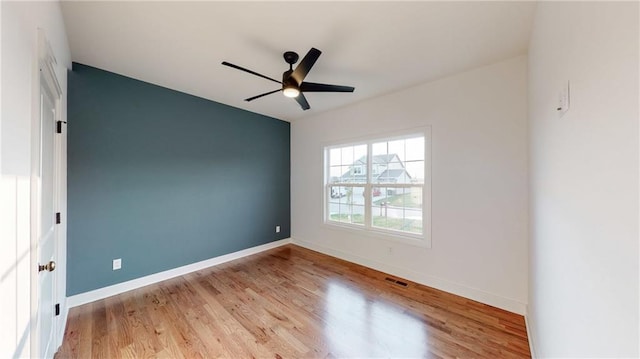 22902 S Ridgeview Dr, Peculiar, MO 64078 - empty room featuring wood finished floors and ceiling fan