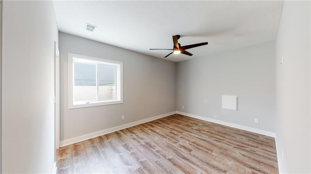 22902 S Ridgeview Dr, Peculiar, MO 64078 - unfurnished room featuring light wood-style floors and a ceiling fan