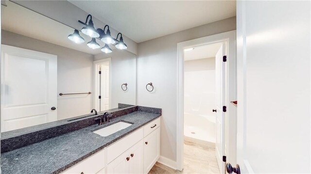 22902 S Ridgeview Dr, Peculiar, MO 64078 - bathroom with vanity and a shower
