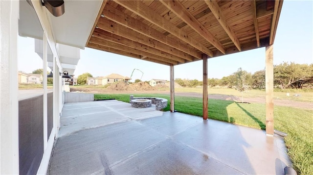 22902 S Ridgeview Dr, Peculiar, MO 64078 - view of patio with an outdoor fire pit