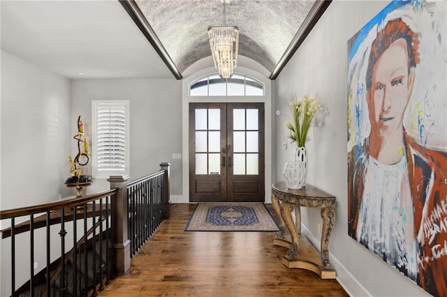 14713 Ash St, Leawood, KS 66224 - entryway with french doors, wood finished floors, a chandelier, and lofted ceiling