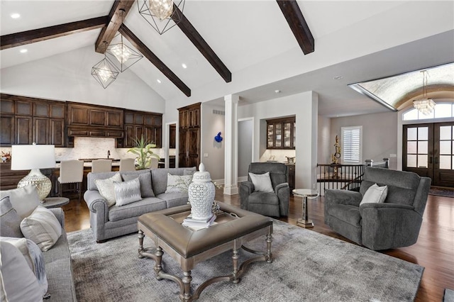 14713 Ash St, Leawood, KS 66224 - living area with wood finished floors, decorative columns, french doors, beamed ceiling, and recessed lighting