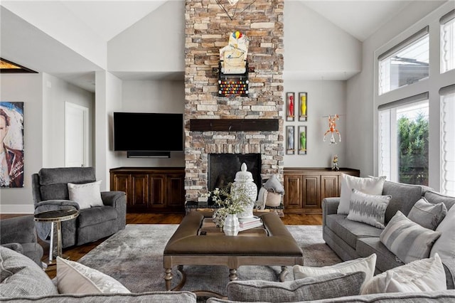 14713 Ash St, Leawood, KS 66224 - living area with high vaulted ceiling, wood finished floors, and a stone fireplace