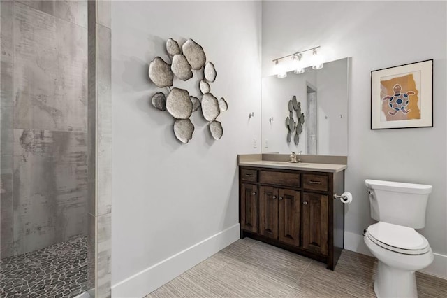 14713 Ash St, Leawood, KS 66224 - bathroom featuring vanity and a tile shower