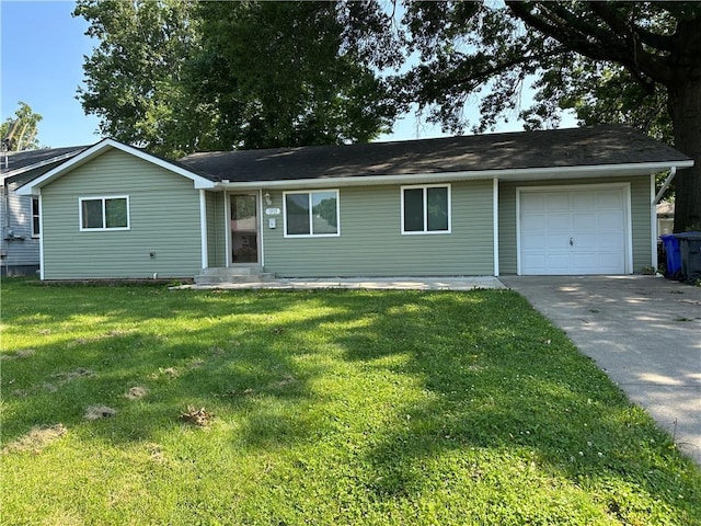 1915 W 5th St, Sedalia, MO 65301 - single story home featuring an attached garage, concrete driveway, and a front lawn