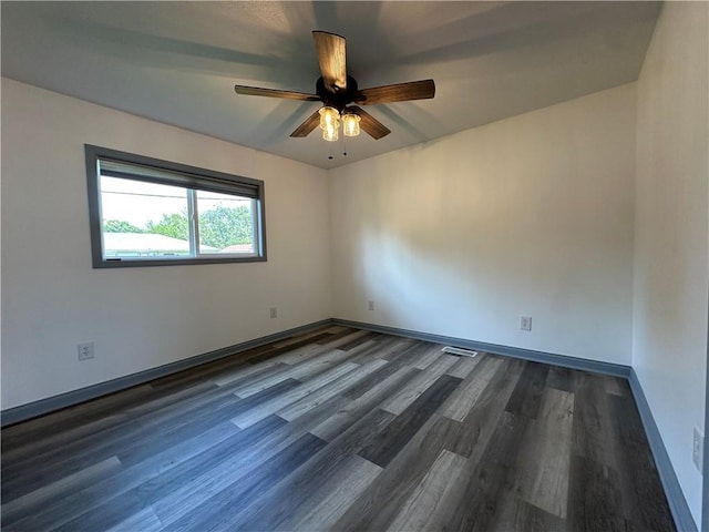 1915 W 5th St, Sedalia, MO 65301 - unfurnished room featuring dark wood finished floors and a ceiling fan