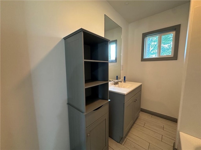 1915 W 5th St, Sedalia, MO 65301 - bathroom featuring vanity and wood tiled floors
