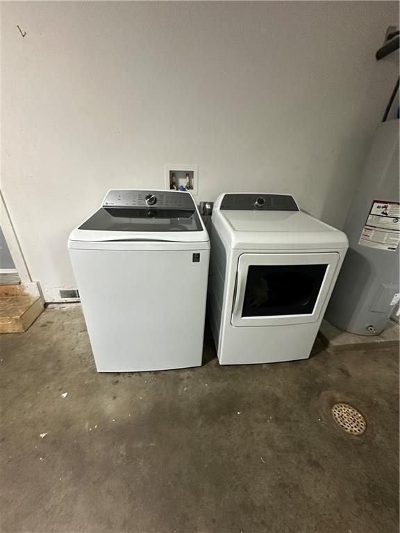 1915 W 5th St, Sedalia, MO 65301 - laundry room featuring independent washer and dryer and water heater