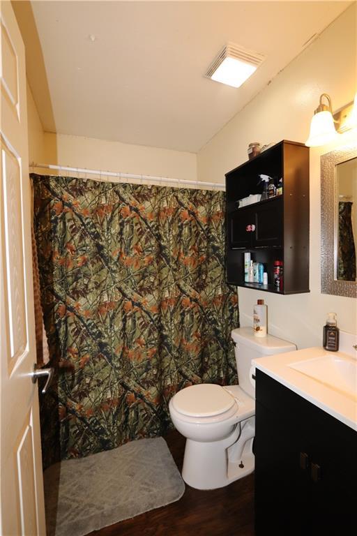 1429 S 6th St, Atchison, KS 66002 - bathroom with vanity and wood finished floors