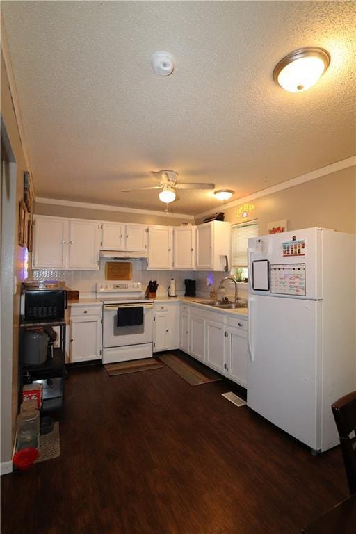 1429 S 6th St, Atchison, KS 66002 - kitchen featuring white appliances, light countertops, white cabinets, dark wood-type flooring, and a textured ceiling