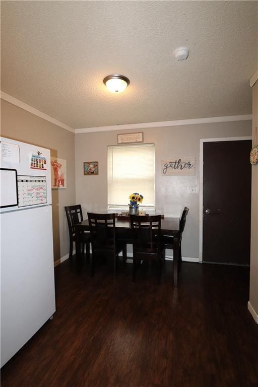 1429 S 6th St, Atchison, KS 66002 - dining space with wood finished floors, ornamental molding, and a textured ceiling