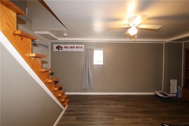 1429 S 6th St, Atchison, KS 66002 - below grade area with ceiling fan, stairway, and wood finished floors