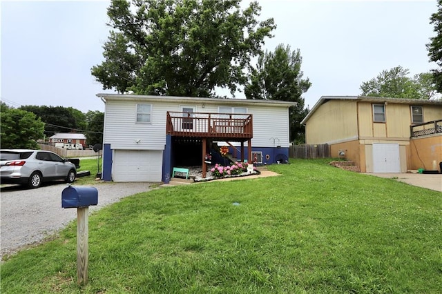 1429 S 6th St, Atchison, KS 66002 - view of front facade featuring gravel driveway, stairway, a front yard, a deck, and an attached garage