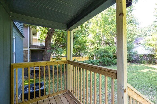 3428 College Ave, Kansas City, MO 64128 - wooden deck featuring a yard