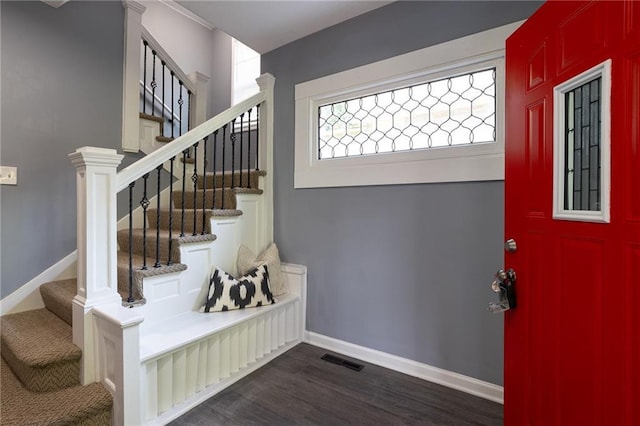3428 College Ave, Kansas City, MO 64128 - foyer with dark wood-style flooring and stairway