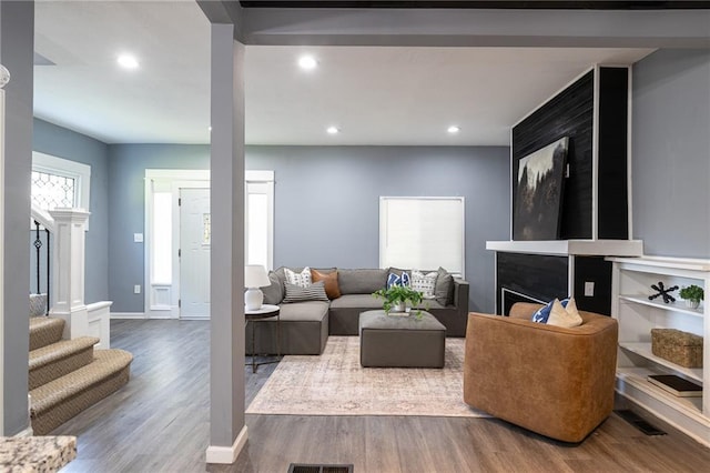 3428 College Ave, Kansas City, MO 64128 - living area with wood finished floors and recessed lighting